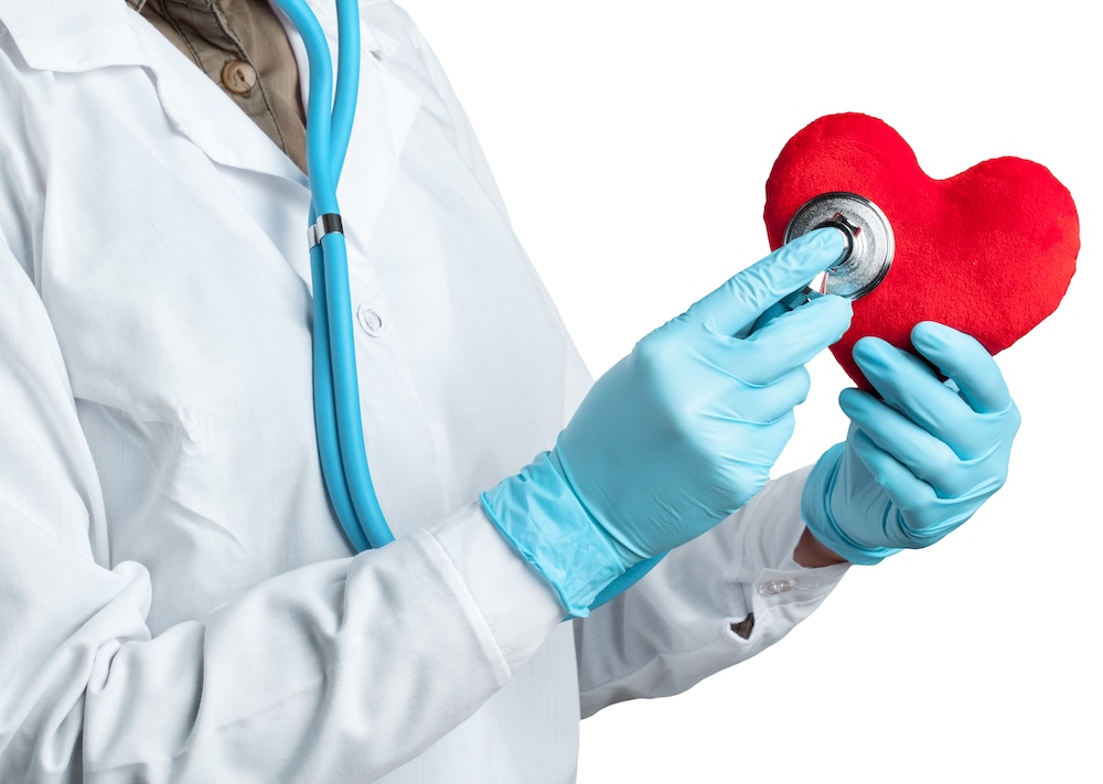 female-cardiologist-uniform-holding-red-heart-isolated-white-background