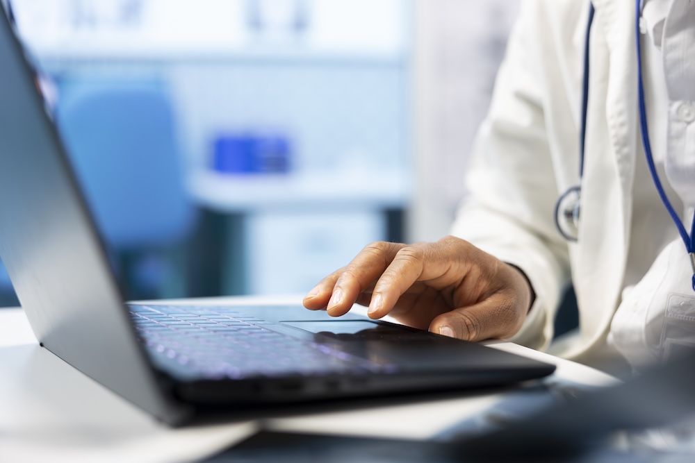 licensed-specialist-examine-healthcare-records-laptop-x-ray-scan-results